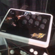 Illustration for article titled Mad Catz Street Fighter IV Sticks Under Glass